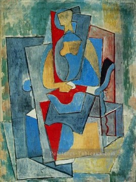 Femme assise dans un fauteuil rouge 1932 cubiste Pablo Picasso Peinture à l'huile